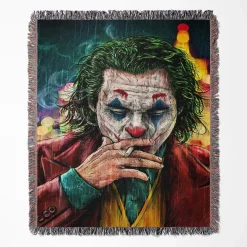 Joker woven tapestry throw blanket, offering bright wall art and cozy room decor, making it a perfect collectible accent for Joker fans.